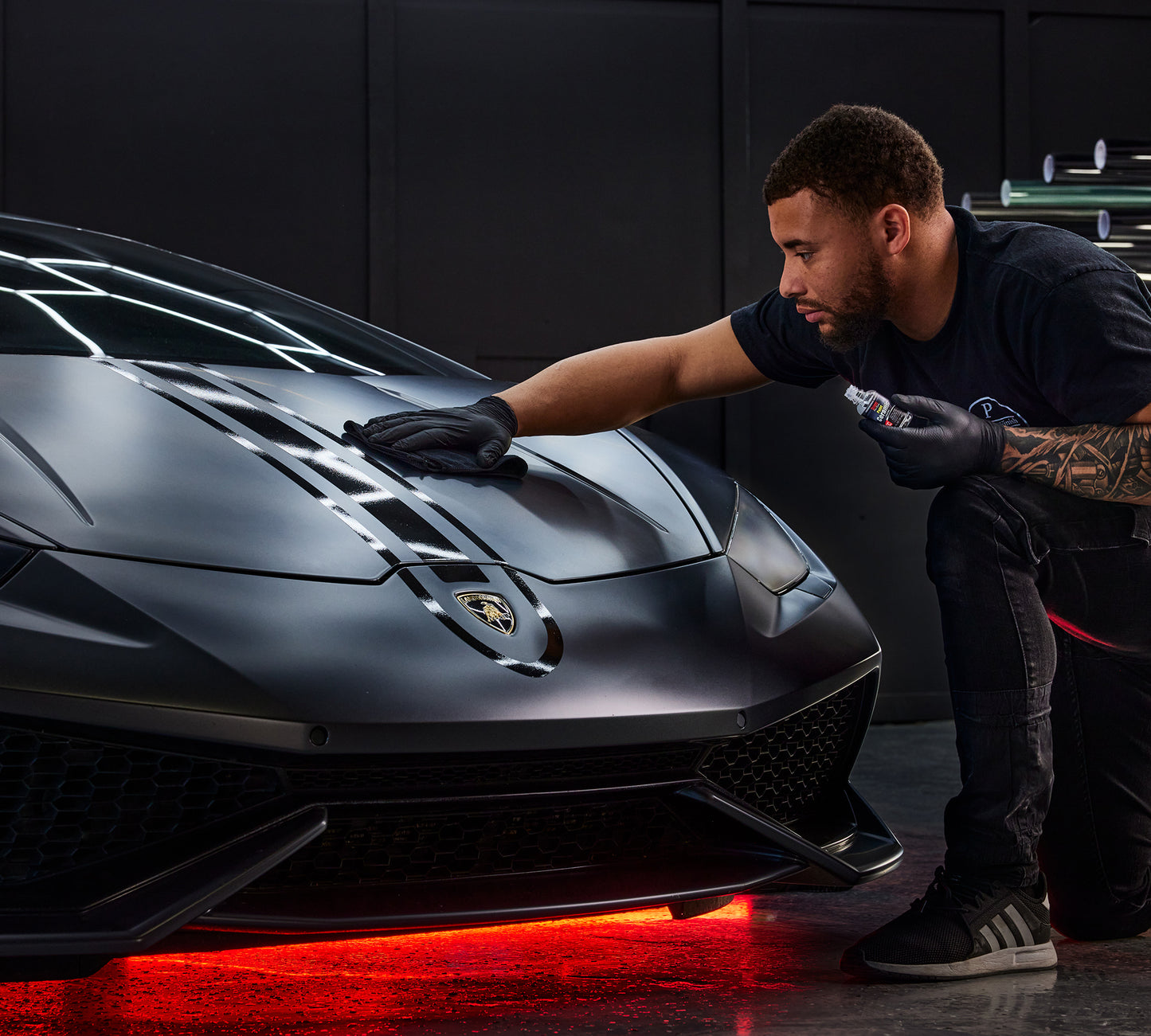 
                  
                    Man cleaning the front of an expensive car using the Stoner Professional Grade Paint Ceramic Coating 30ml
                  
                